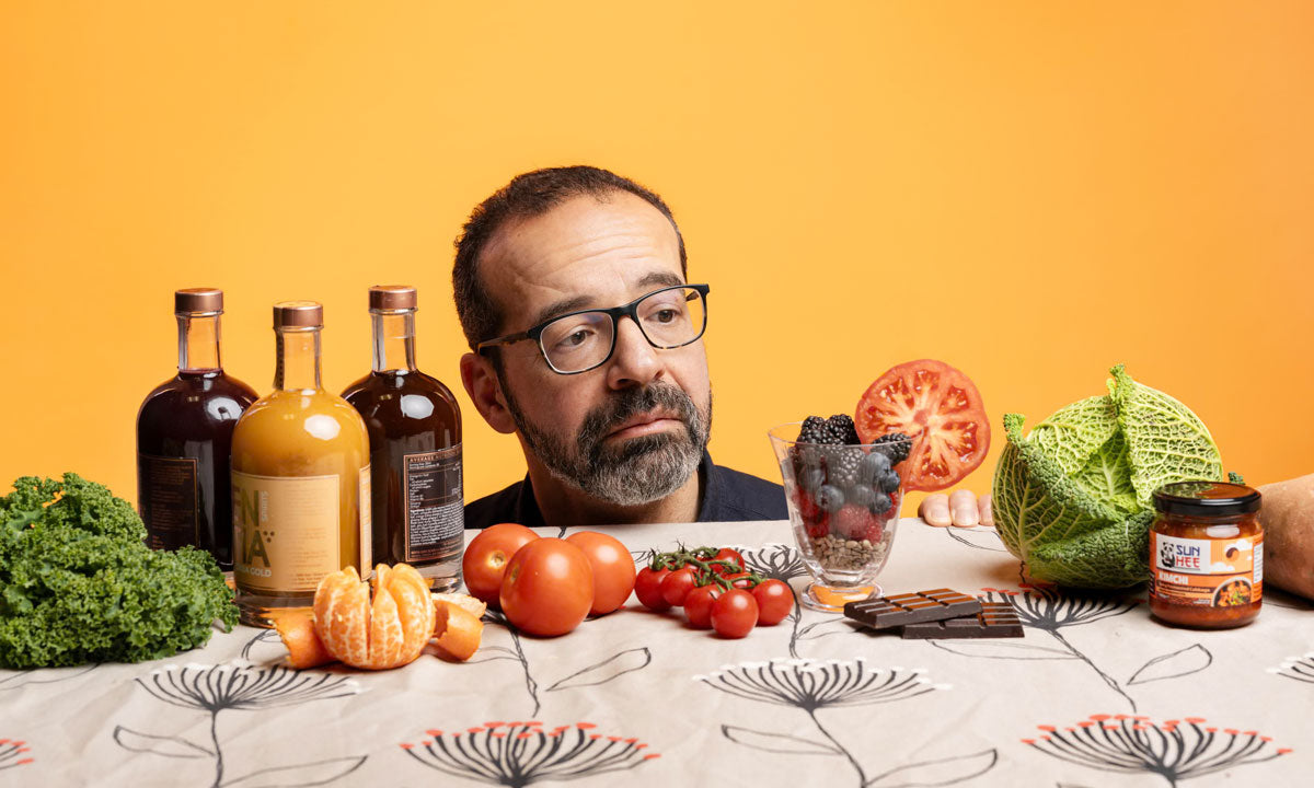 Steve Rose looking at a glass of fruit